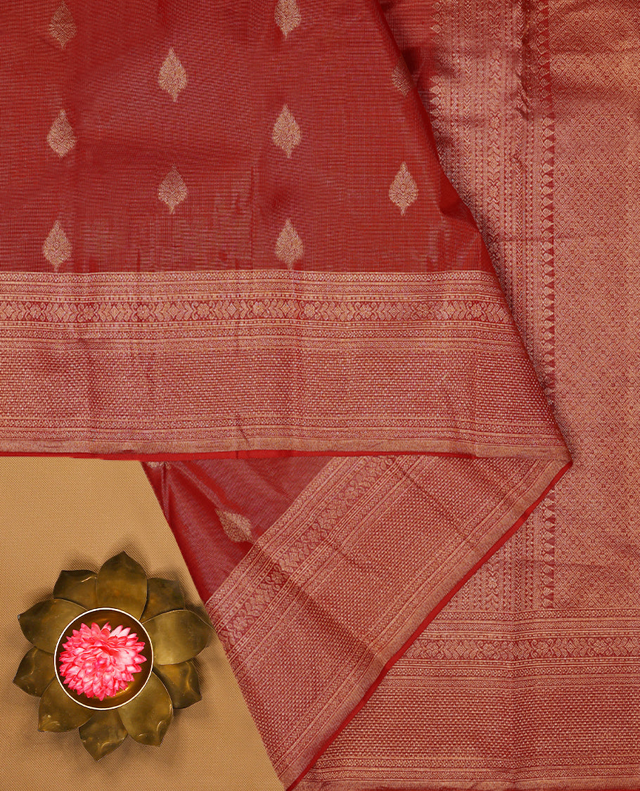 Red Colour Manthrakodi saree featuring tissue weaving with traditional motifs on the body, complemented by a self coloured traditional border and a matching self coloured blouse.