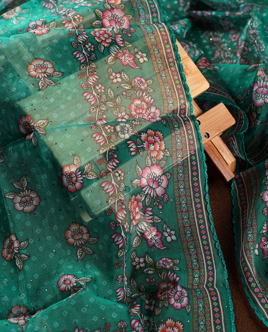 Teal green churidhar material featuring a printed top with delicate floral vine motifs, paired with a floral bordered dupatta and plain bottom & A perfect blend of elegance and comfort for festive and casual wear.