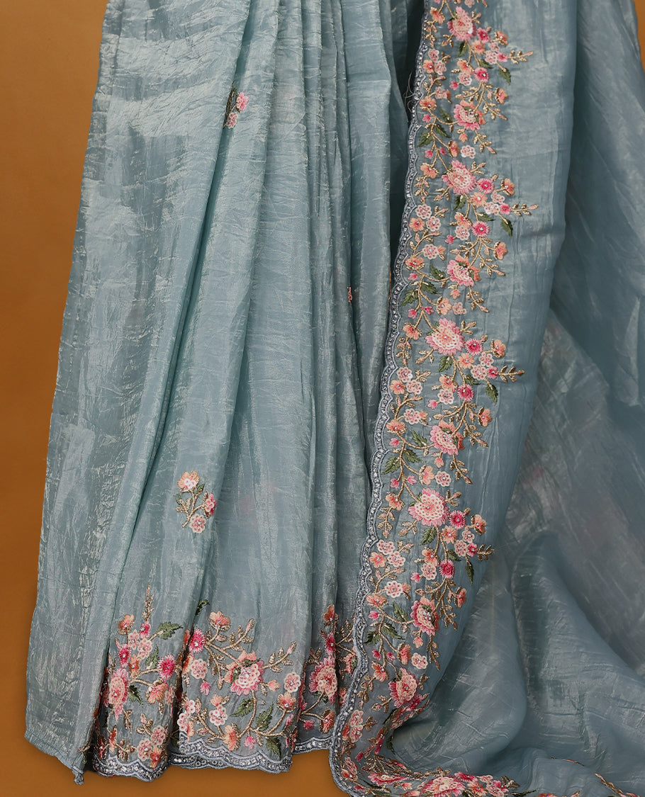 Dusty Blue Crush Soft Silk saree featuring Floral Thread Works on the body, complemented by delicate floral embroidery border and a matching blouse.