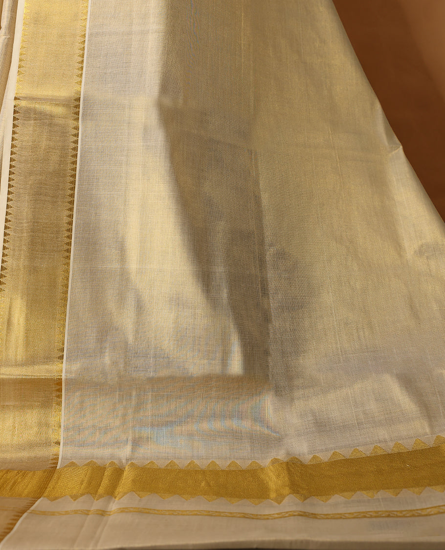 Elegant Light Gold colour Tissue Kerala saree featuring Plain body and traditional golden zari kasavu border offering a classic and graceful look, paired with a matching blouse.
