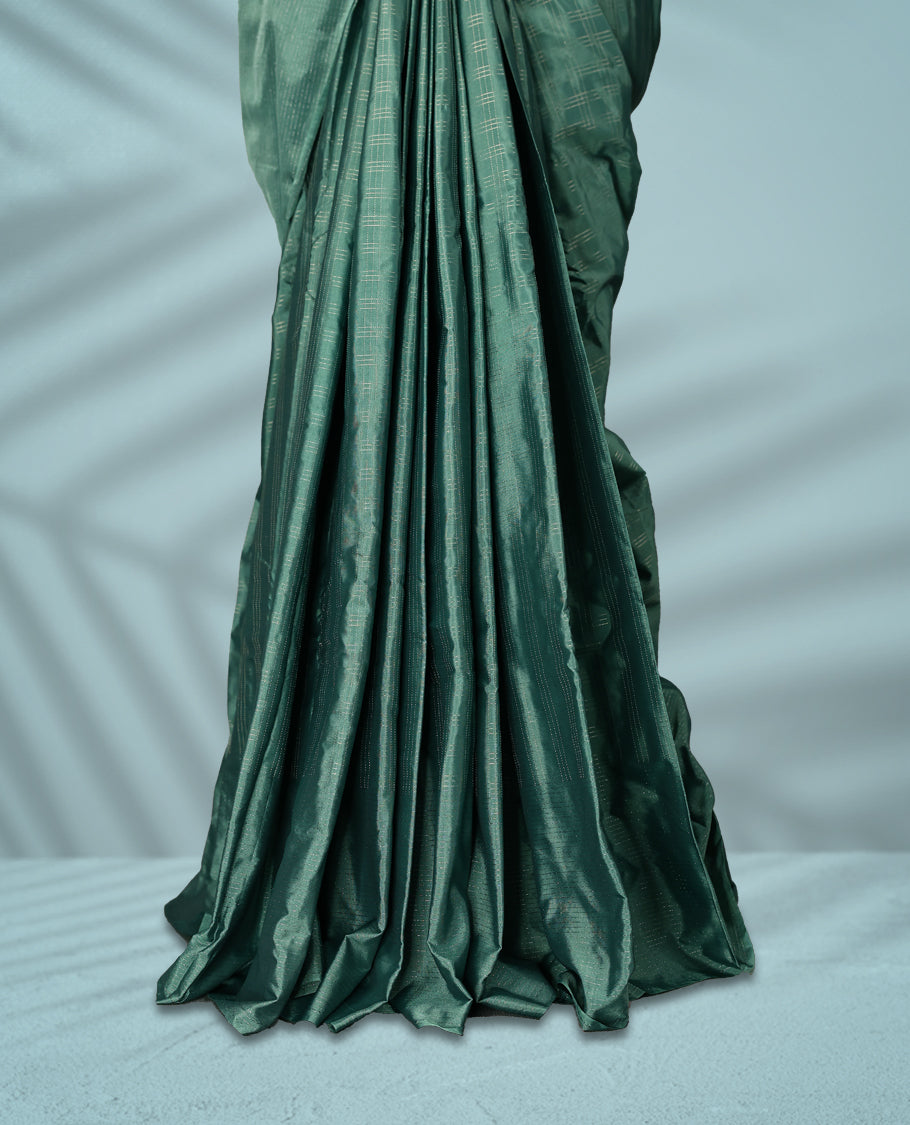 Pastel teal green Colour semi silk saree features subtle Silver zari check patterns throughout and Self Colour border, comes with a matching blouse