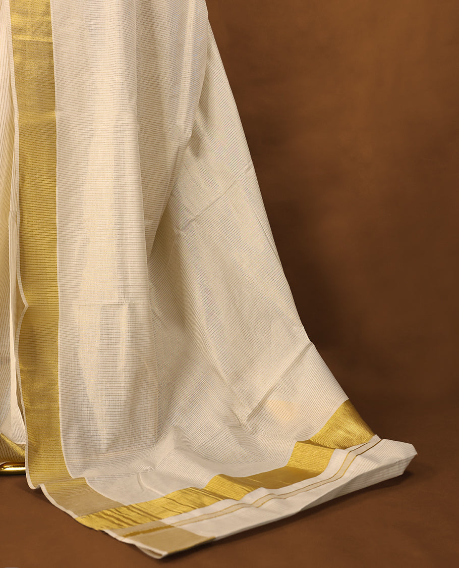 Kerala saree exudes timeless grace with its ivory base and rich golden zari border with Matching Blouse.