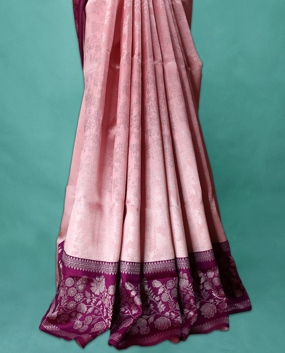 Light Onion coloured semi silk saree featuring a Silver coloured floral jaal design on the body, paired with a Grape coloured border and matching blouse.