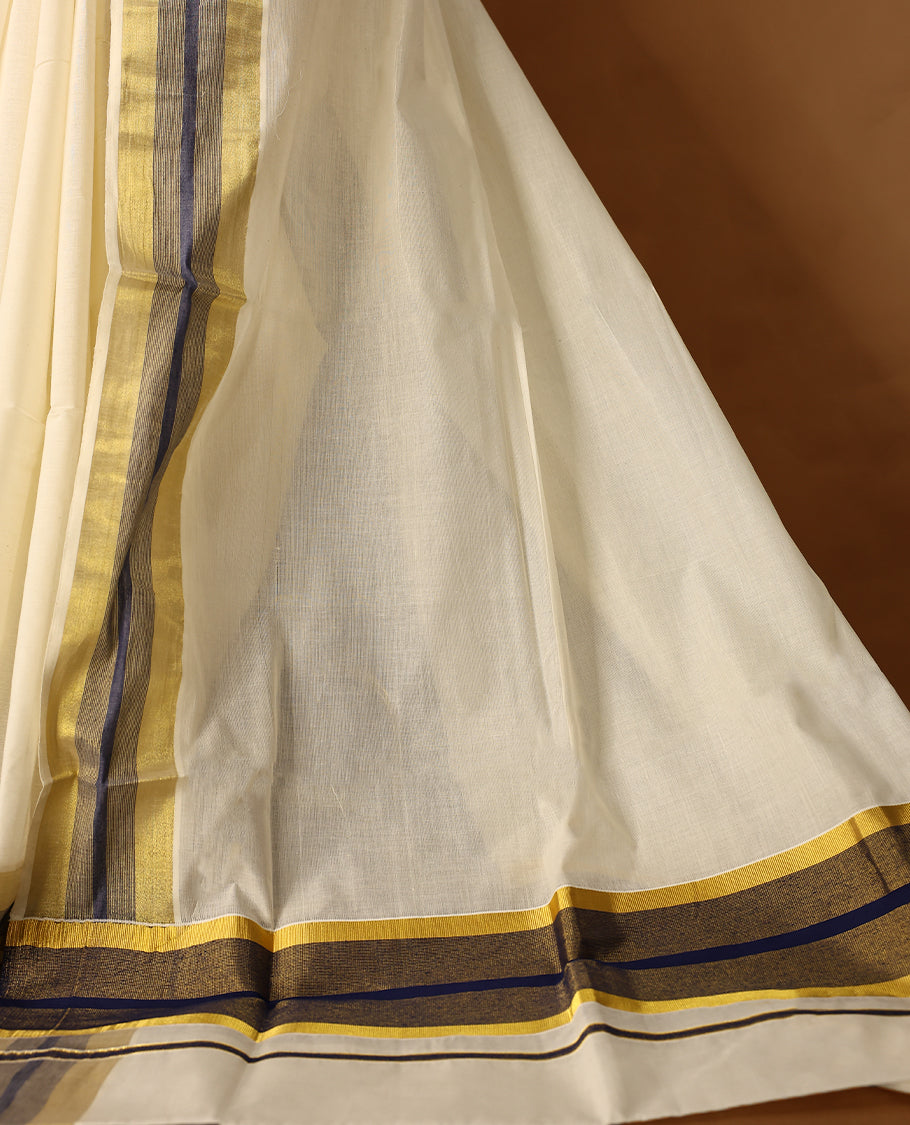 Elegant off white colour cotton Kerala saree featuring Plain body, Navy Blue colour & golden zari kasavu border offering a classic and graceful look, paired with a matching blouse.