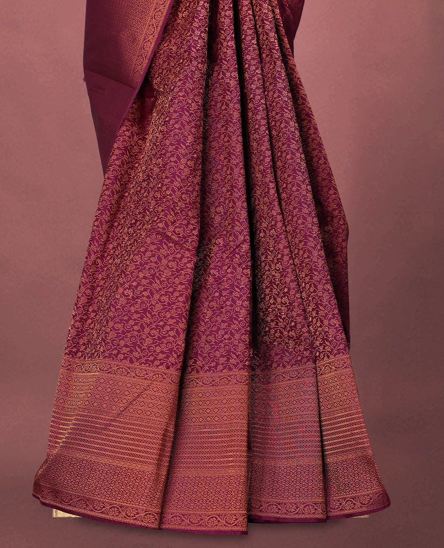 Bordeaux colour Kancheepuram saree featuring an antique zari brocade body, complemented by a traditional border and a matching blouse.