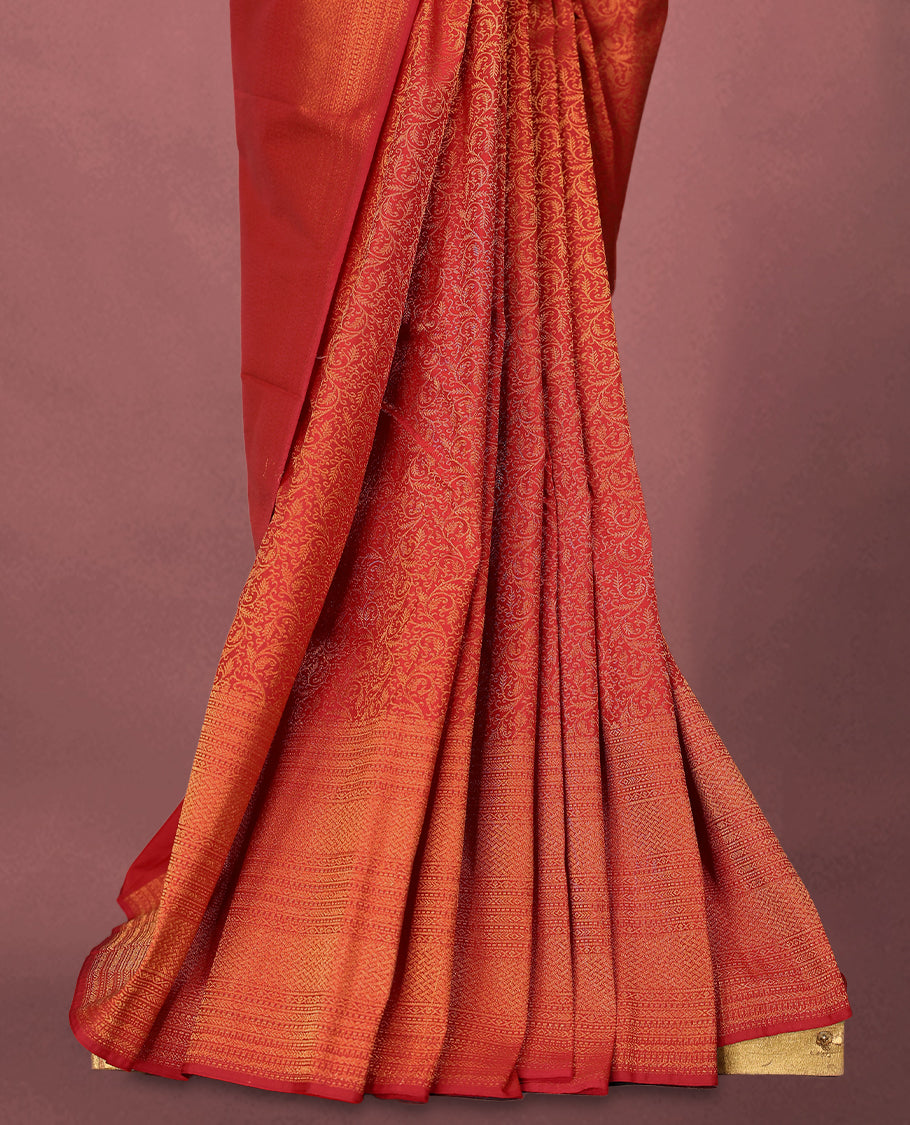 Chilli Red colour Kancheepuram saree featuring an antique zari brocade body, complemented by a traditional border and a matching blouse.