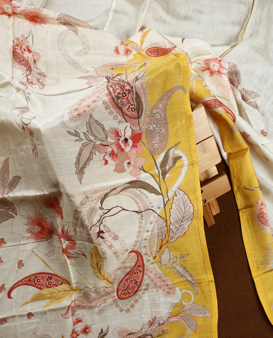 Cream colour churidhar material with pink floral and paisley prints, enhanced by a yellow border and delicate embroidery & Comes with matching plain bottom and dupatta.