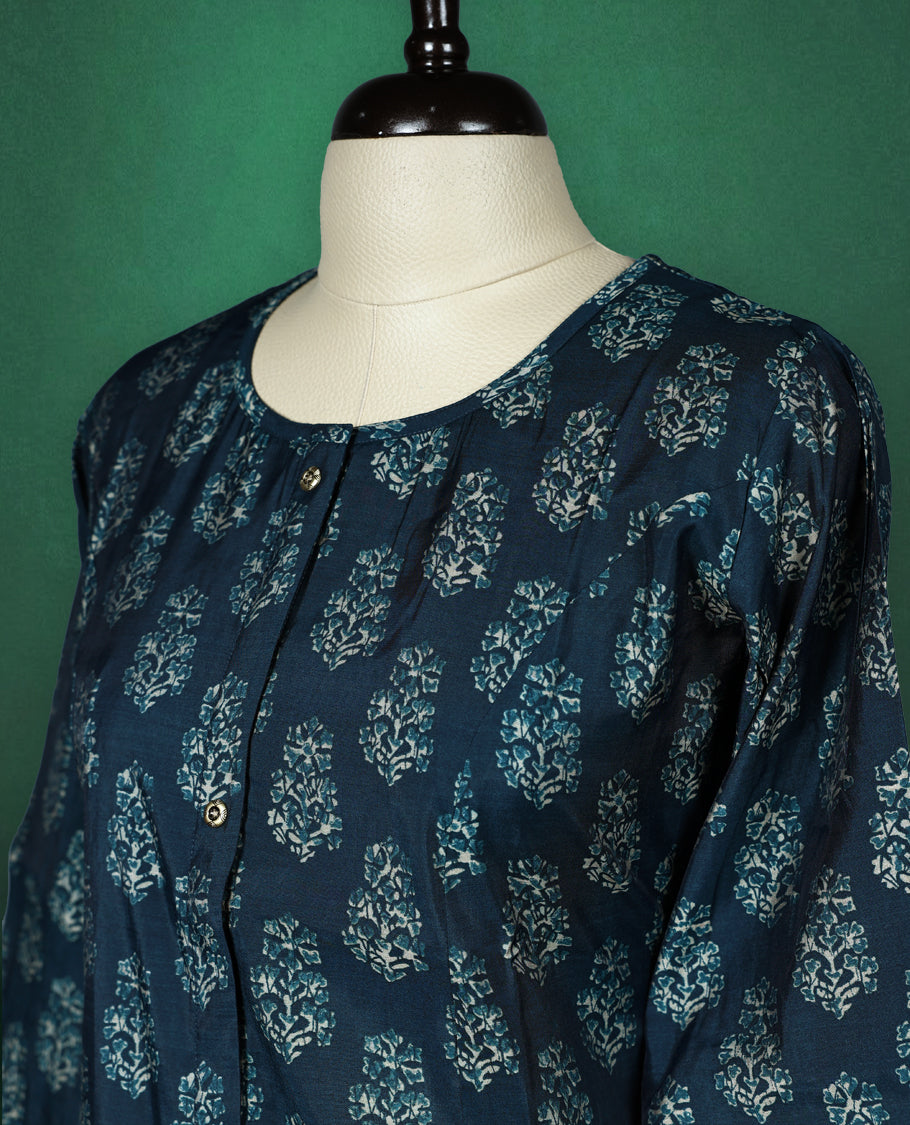 Navy blue colour kurti with a round neck and three quarter sleeves, featuring elegant light blue floral block prints for a classic ethnic look, perfect for casual outings or semi formal occasions.