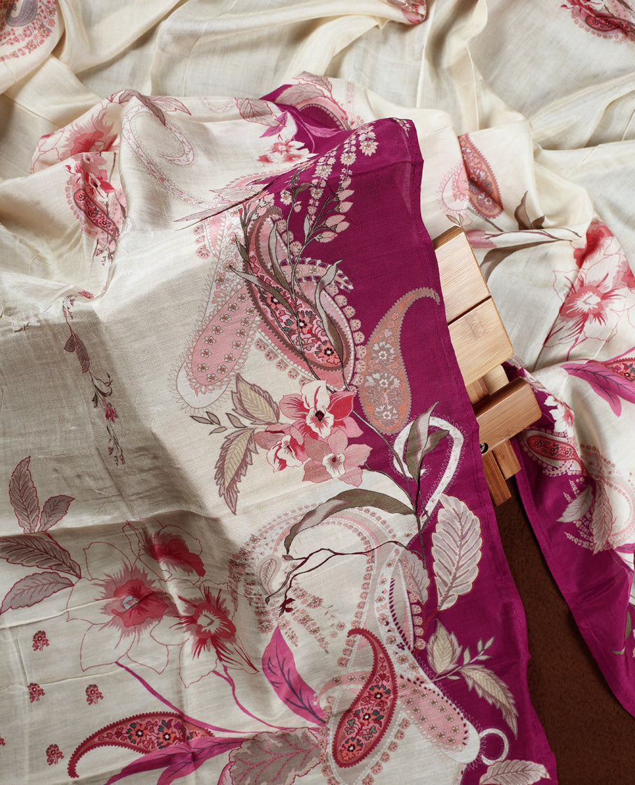 Cream colour churidhar material with pink floral and paisley prints, enhanced by a dark magenta border and delicate embroidery & Comes with matching plain bottom and dupatta.