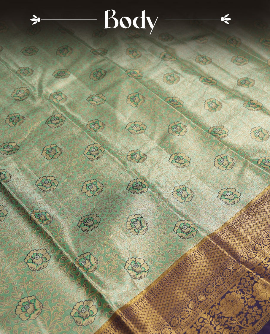 Aqua green colour and antique gold Zari Tissue Brocade Saree features intricate floral Motifs on body and rich Violet colour with traditioal Border & pallu with Gold Zari Patterns paired with matching blouse