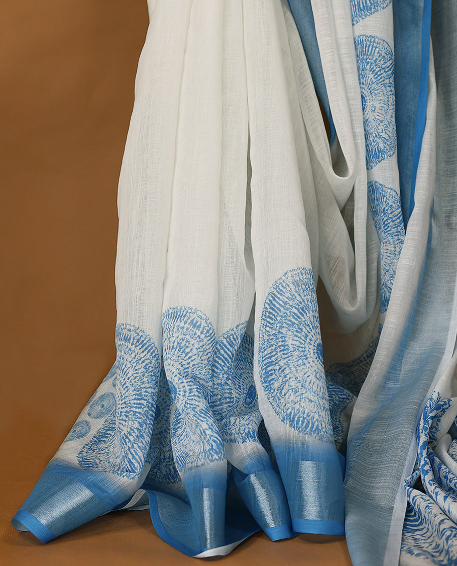 Blue and white cotton saree featuring a nature-inspired abstract print and a Blue border with Matching Blouse