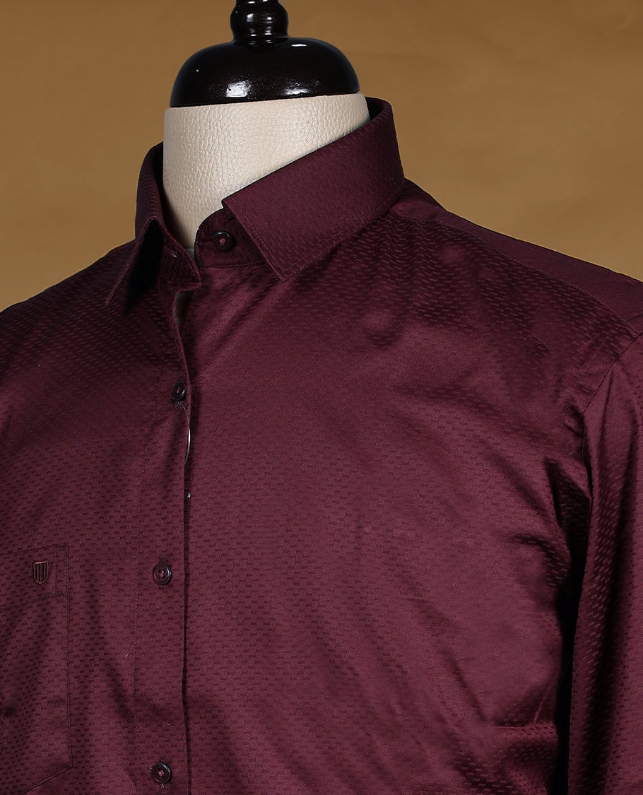 Maroon colour OTTO men’s shirt in a relaxed formal fit, featuring a subtle dotted self design texture, full sleeves, classic collar, and chest pocket ideal for both office and evening wear.