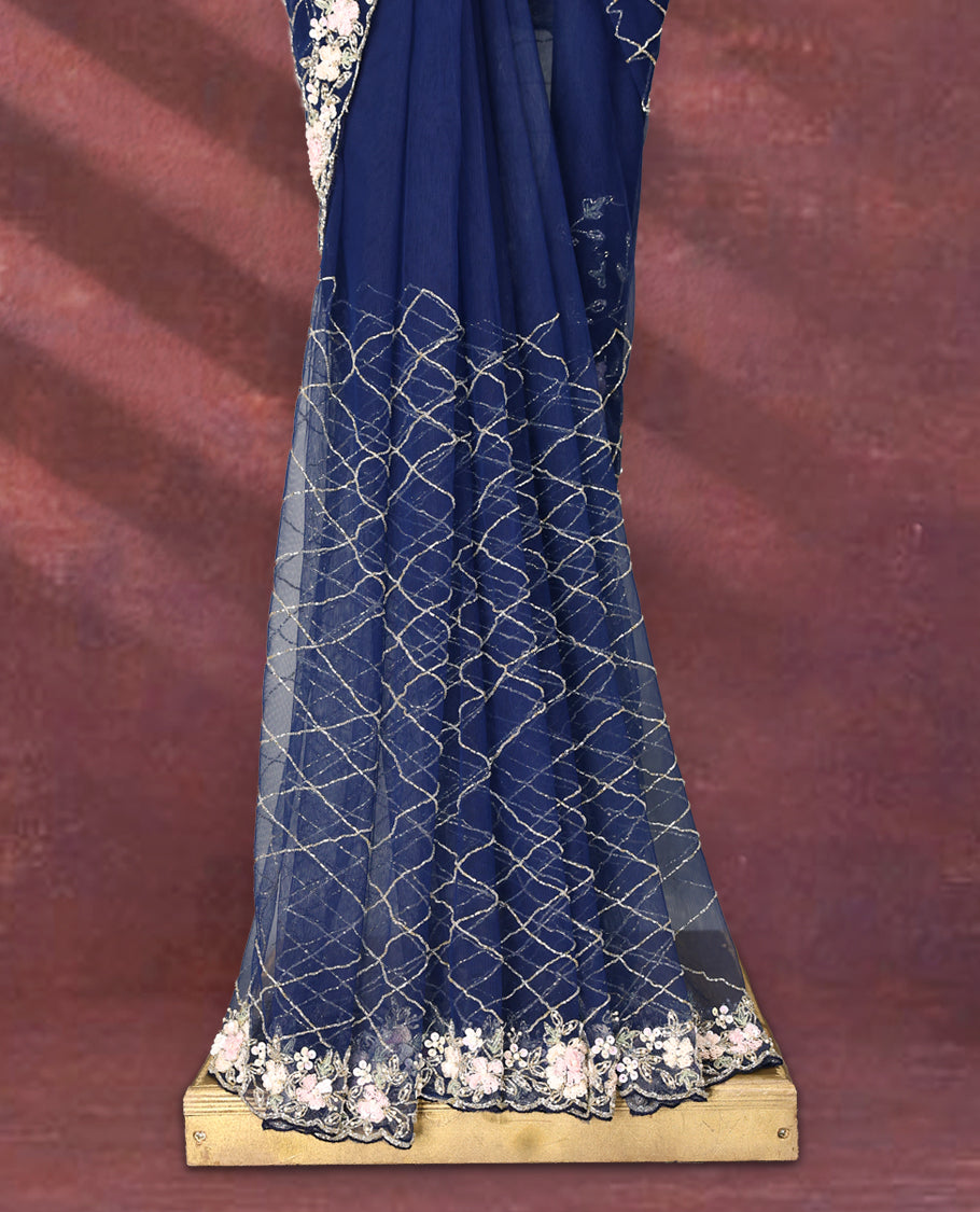 Navy Blue colour net designer saree featuring crisscross cut beads detailing on the body, adorned with beads and sequin worked floral kodi scallop border, paired with a matching worked blouse