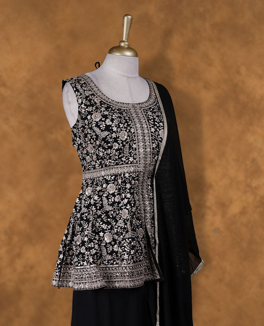 Black colour sharara set adorned with intricate light silver embroidery and sequins work & The fitted embellished top pairs beautifully with the flared bottoms and matching dupatta.