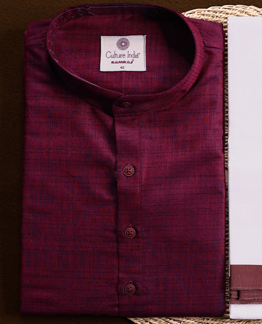 RAMRAJ maroon kurtha paired with a white dhoti, elegantly finished with a matching maroon border.