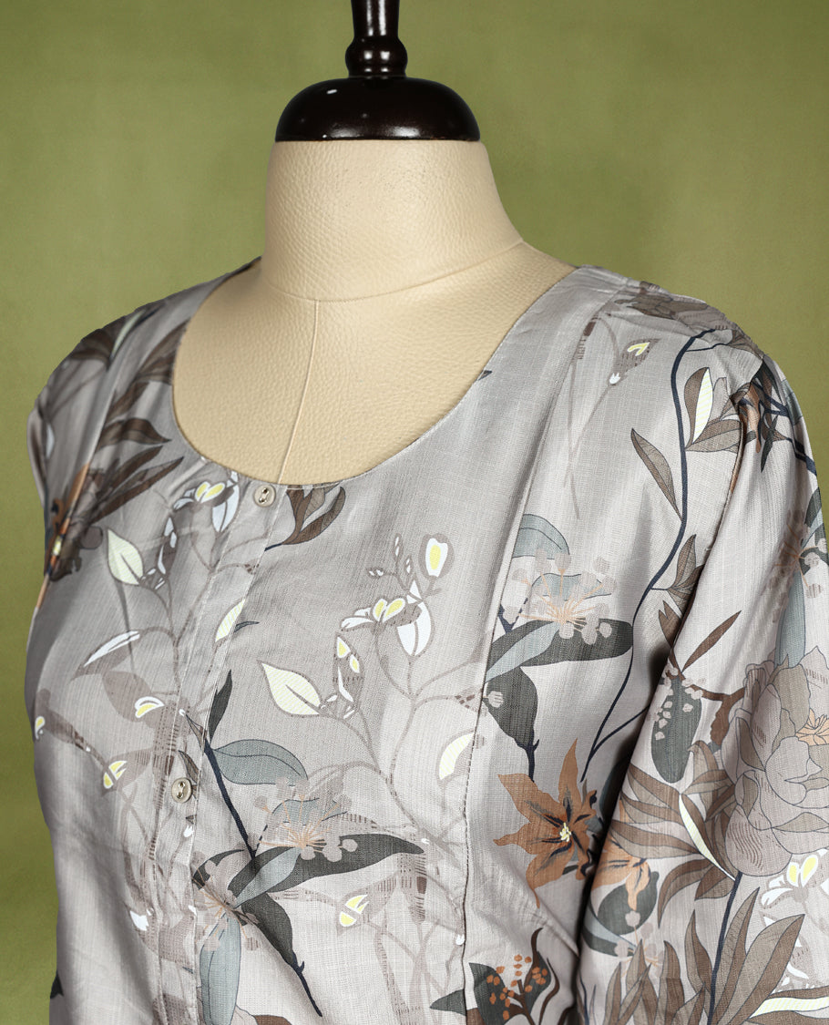 Elegant light grey straight cut kurti featuring soft floral digital prints in earthy tones, designed with a round neckline, subtle front buttons, and 3/4th sleeves, perfect for casual or workwear styling