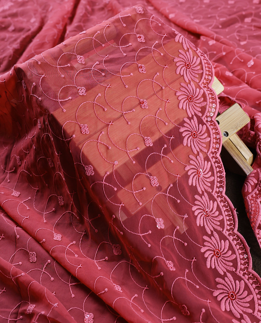 Rose wine colour churidhar material adorned with intricate floral embroidery and sequin highlights, paired with a plain matching bottom and beautifully embroidered dupatta, perfect for festive celebrations and graceful occasions.