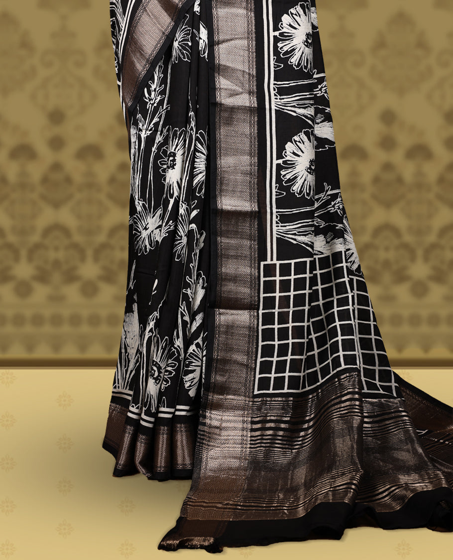 Black colour saree with off white floral and geometric prints, featuring a contrast zari border and beautifully detailed printed pallu & Comes with a matching black blouse piece.