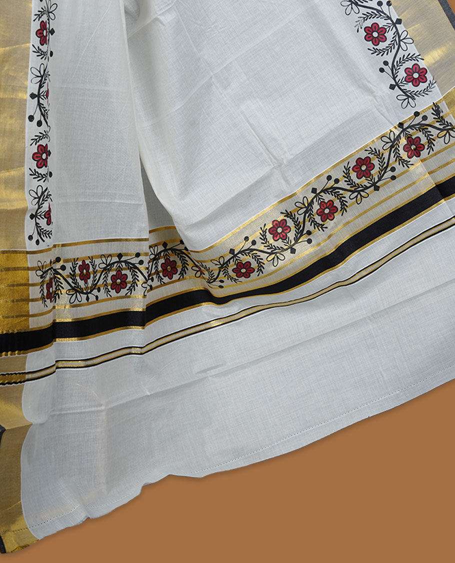 Off white colour cotton Kerala saree with floral printed borders, highlighted by a golden zari border and classic pallu, paired with a matching blouse.