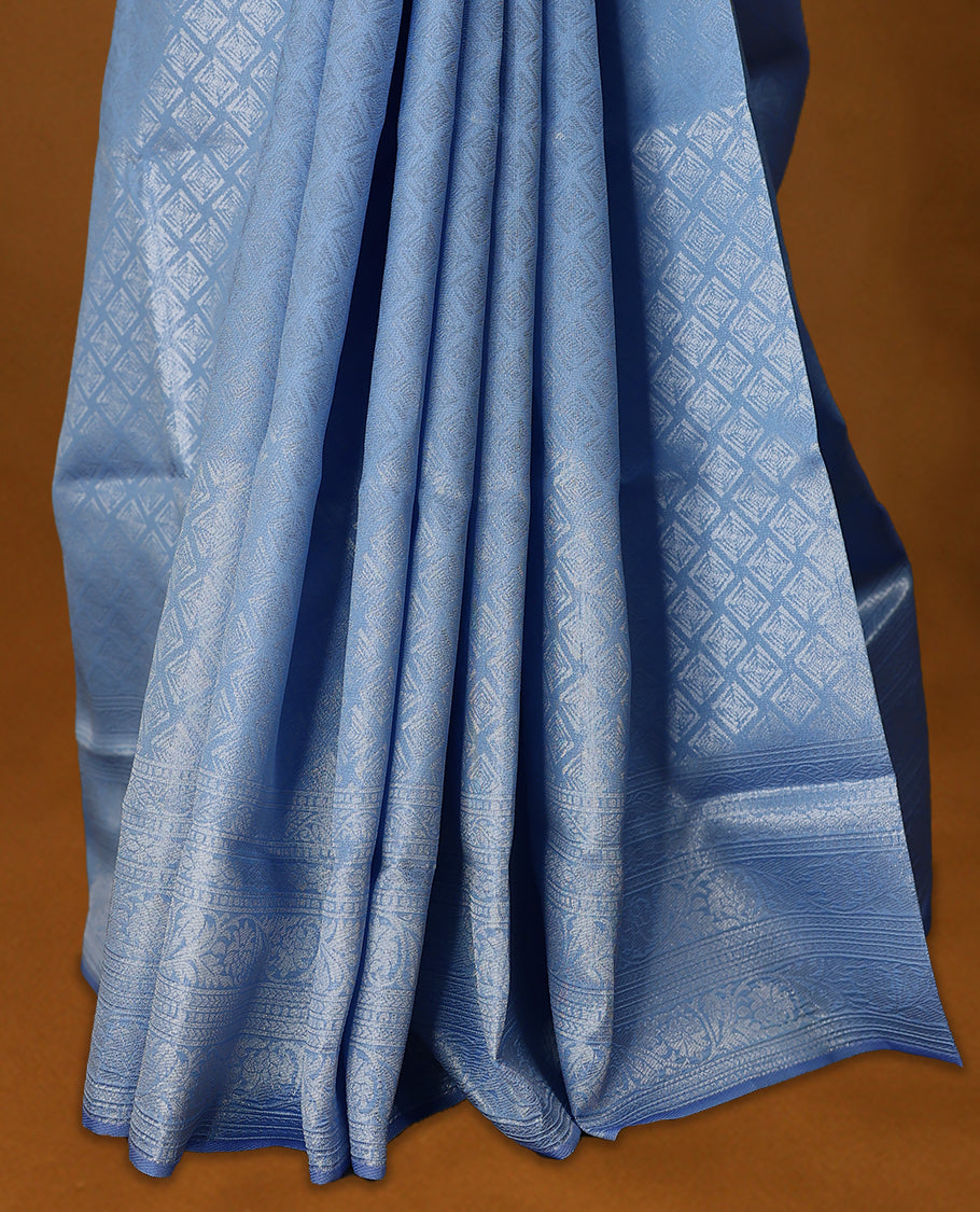 Sky Blue coloured semi silk saree featuring a Silver coloured Zari Diamond design on the body, paired with a Self coloured border and matching blouse.
