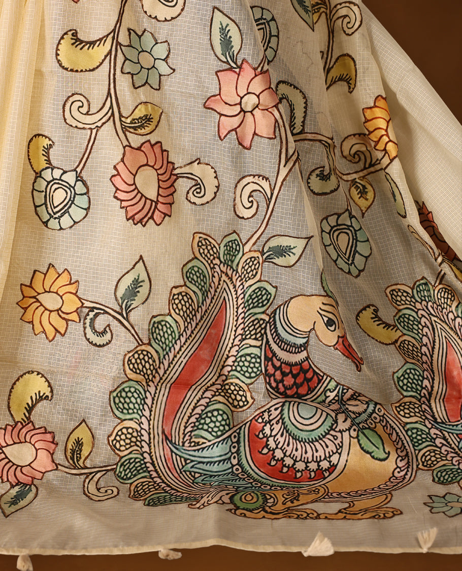 Elegant off white colour Kota net saree highlighted with vibrant hand painted motifs of peacocks and floral patterns on the pallu, blending tradition with artistic finesse & Perfect for festive and cultural occasions.