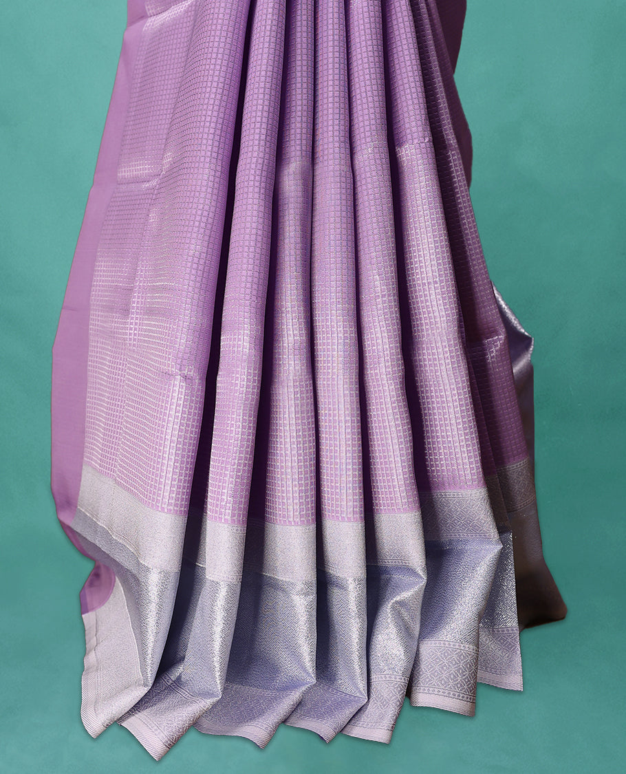 Violet coloured semi silk saree featuring a Check design on the body, paired with a Baby Blue coloured border and matching blouse.