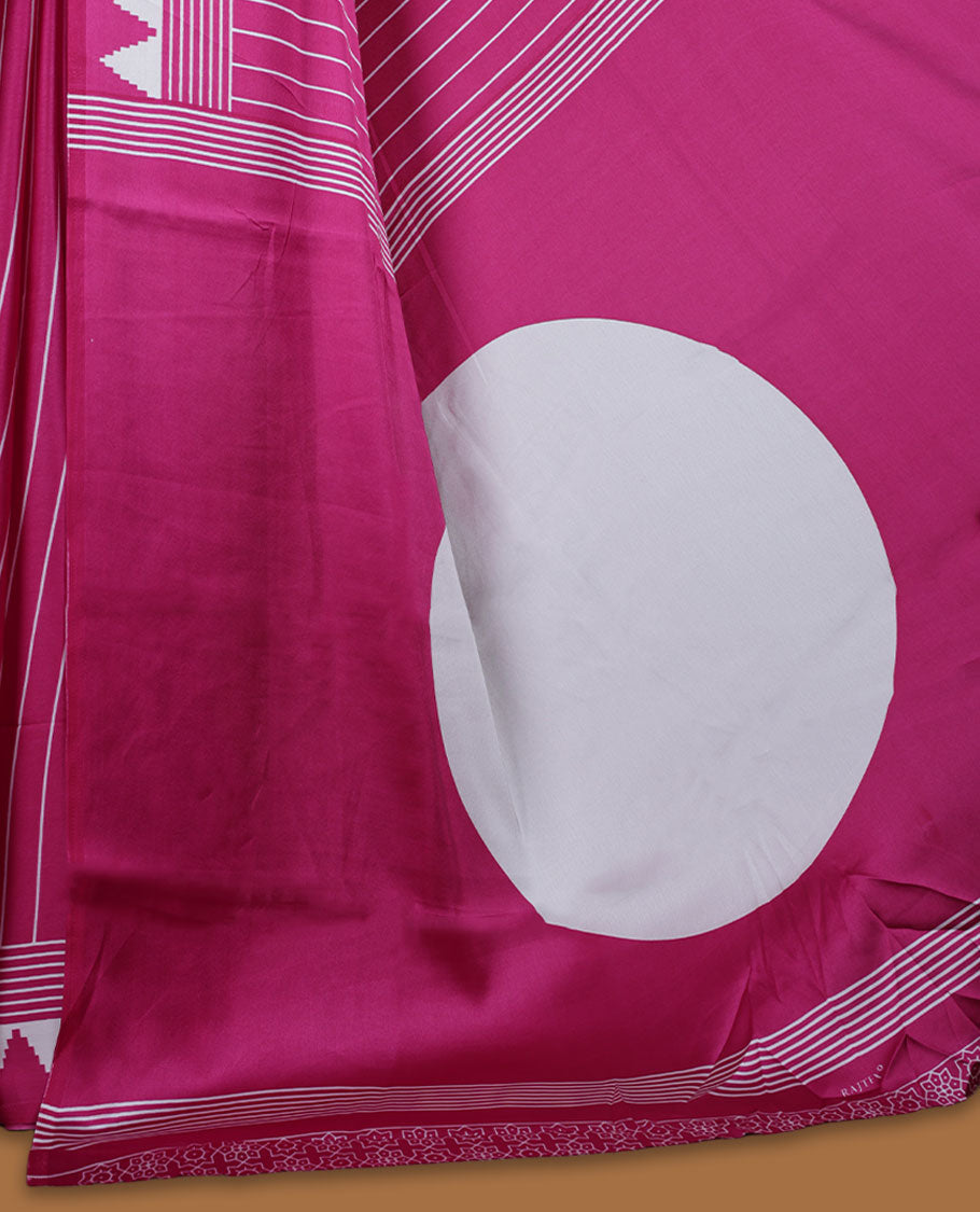 Dark Pink colour semi modal saree featuring bold white geometric borders and fine stripe detailing, finished with an oversized white circular motif on the pallu, paired with a matching printed blouse.