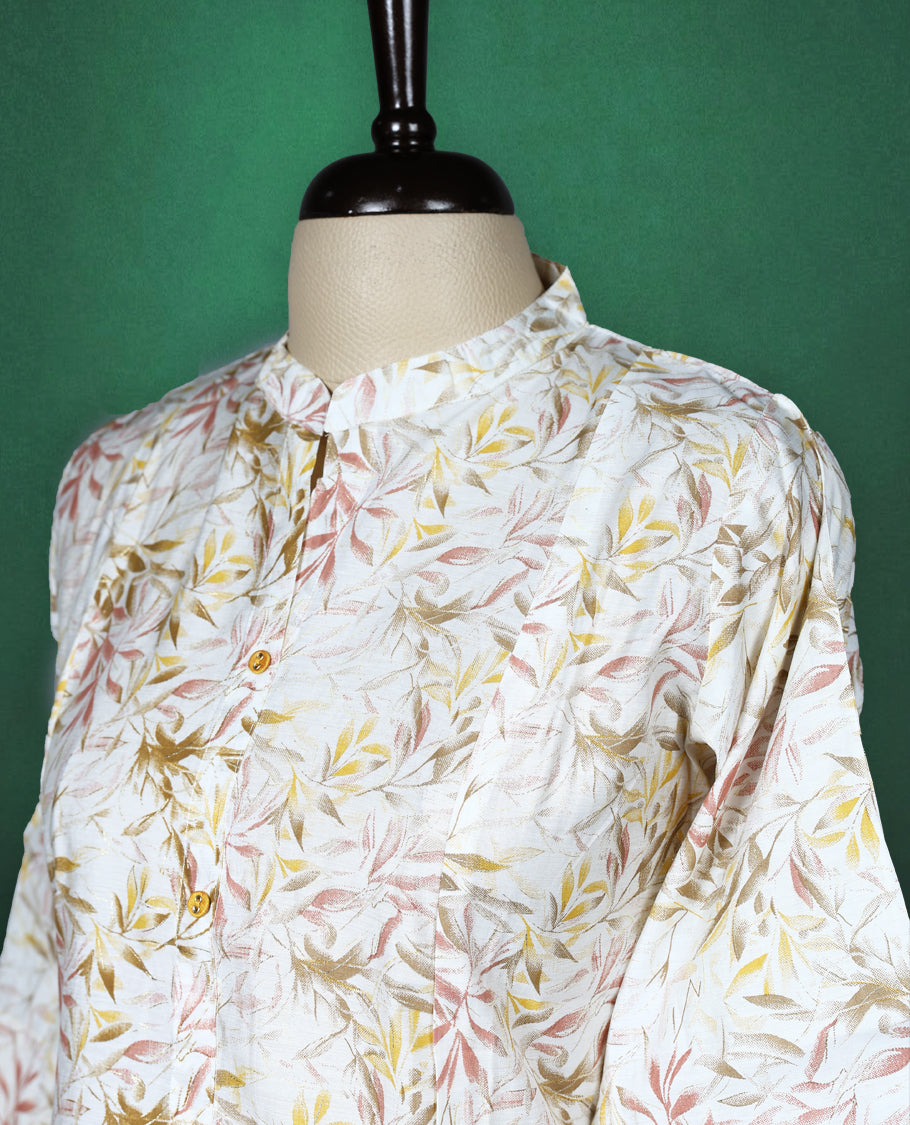 Off white cotton kurti featuring an all over leaf print, styled with a smart mandarin collar, front buttons, and elbow length sleeves perfect for a relaxed, everyday look.