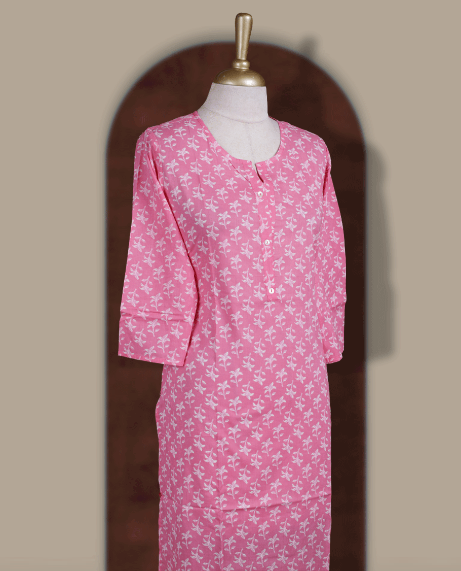 Soft pink colour kurthi with off white floral prints, crafted from soft cotton for a breezy and elegant look & styled with a round V notch neckline and comfortable 3/4th sleeves and a button down front.