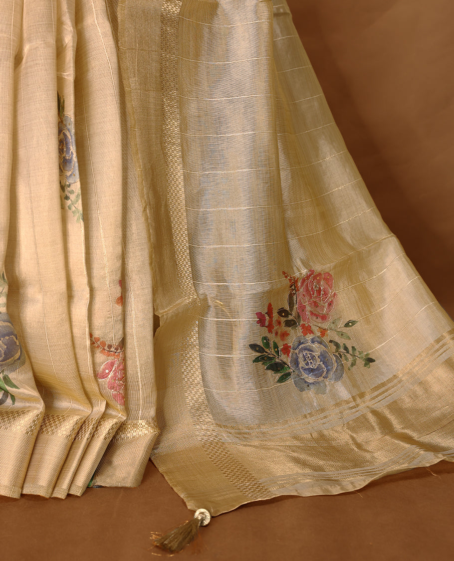 Light gold colour organza Kerala saree featuring subtle checkered weave with zari detailing on the border and pallu, highlighted with delicate floral accents near the pleats, paired with a matching blouse.