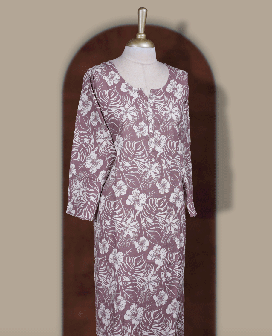 Mauve colour kurti adorned with elegant off white floral prints, Featuring a round neckline and three quarter sleeves.