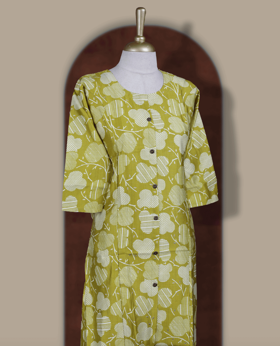 Lemon green colour kurthi with off white floral prints, crafted from soft cotton for a breezy and elegant look & Features a round neckline, 3/4th sleeves, and a button down front.
