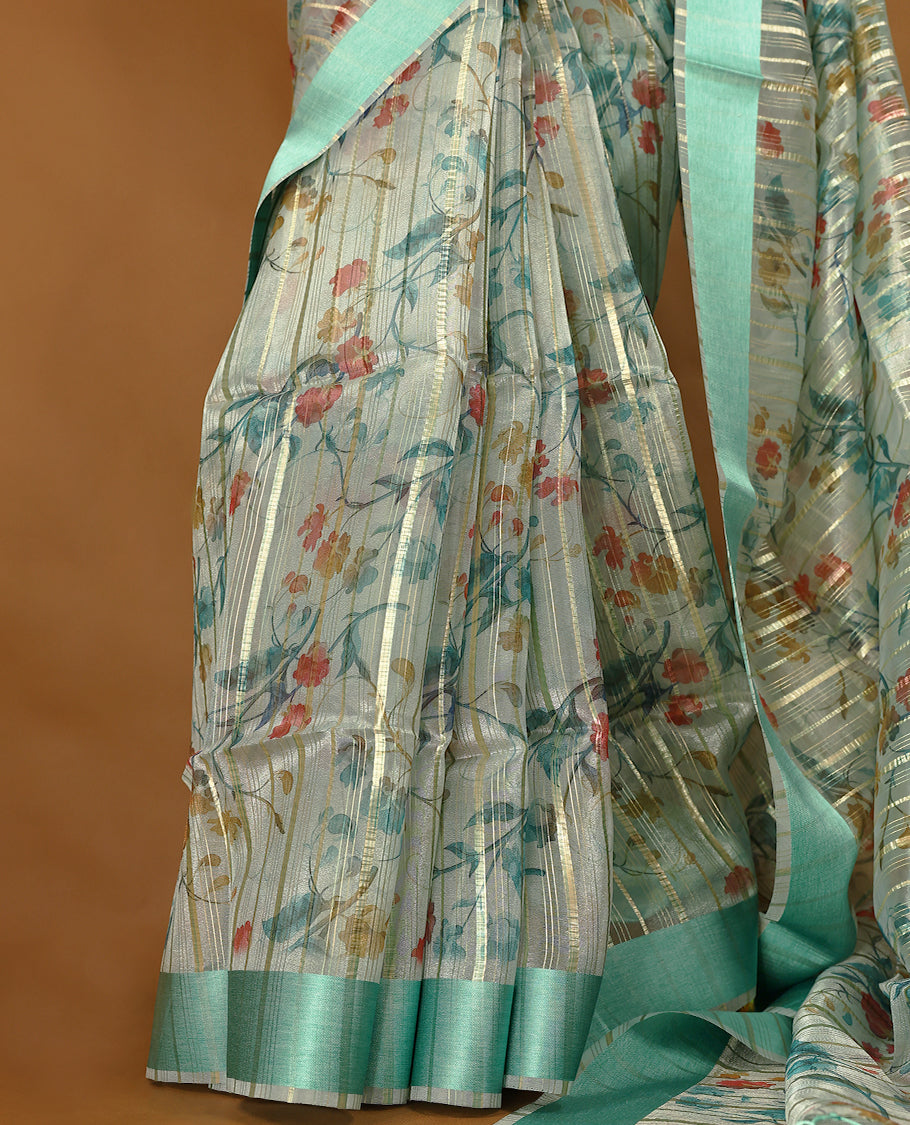 Light aqua semi-organza saree with intricate floral jaal work, elegant border, and a matching silk brocade blouse.