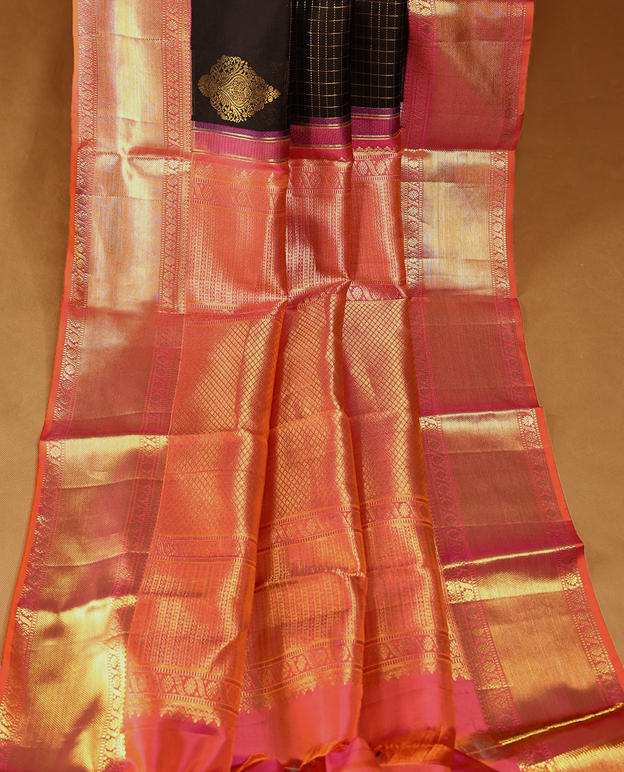 Black Colour pure traditional Kancheepuram silk saree featuring antique zari check designs on the body, complemented by a traditional contrast coloured border and a matching contrast blouse.