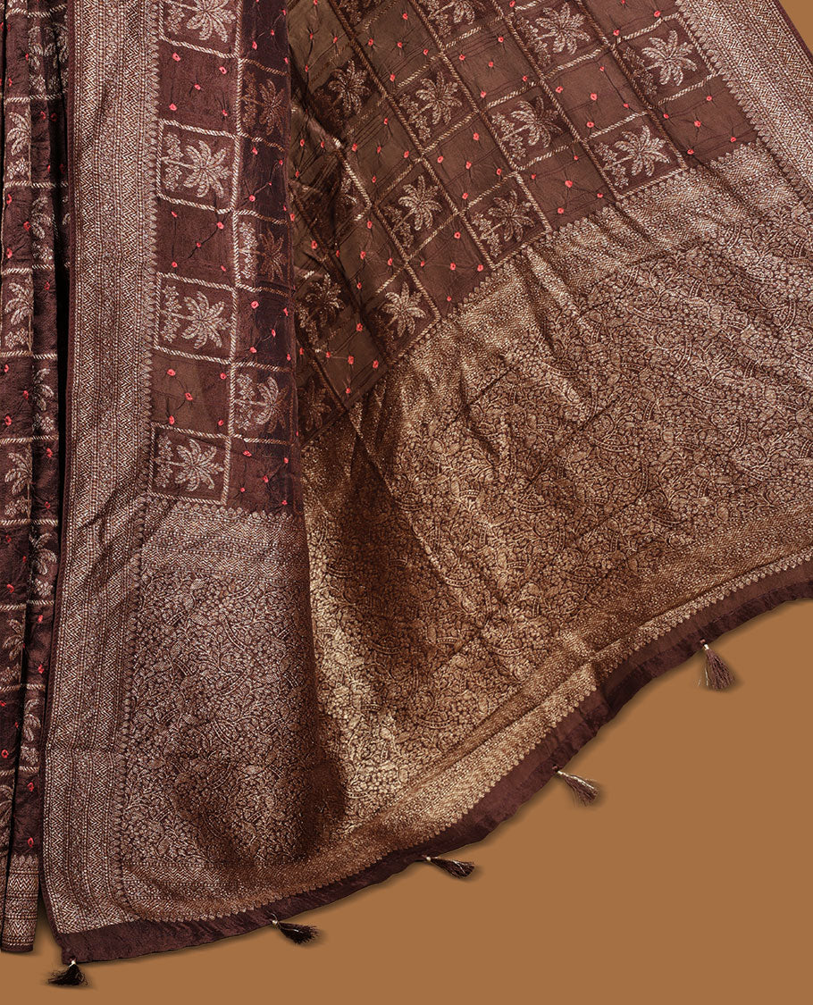Dark Brown colour Banarasi Bandhani silk saree featuring with intricate Banarasi motifs on body, complemented by antique zari woven border and grand pallu, paired with matching blouse