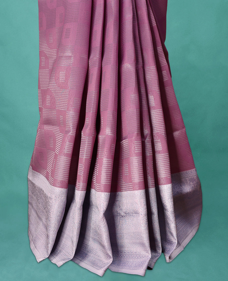 Pastel Pink coloured semi silk saree featuring a Zari design on the body, paired with a Baby Blue coloured border and matching blouse.