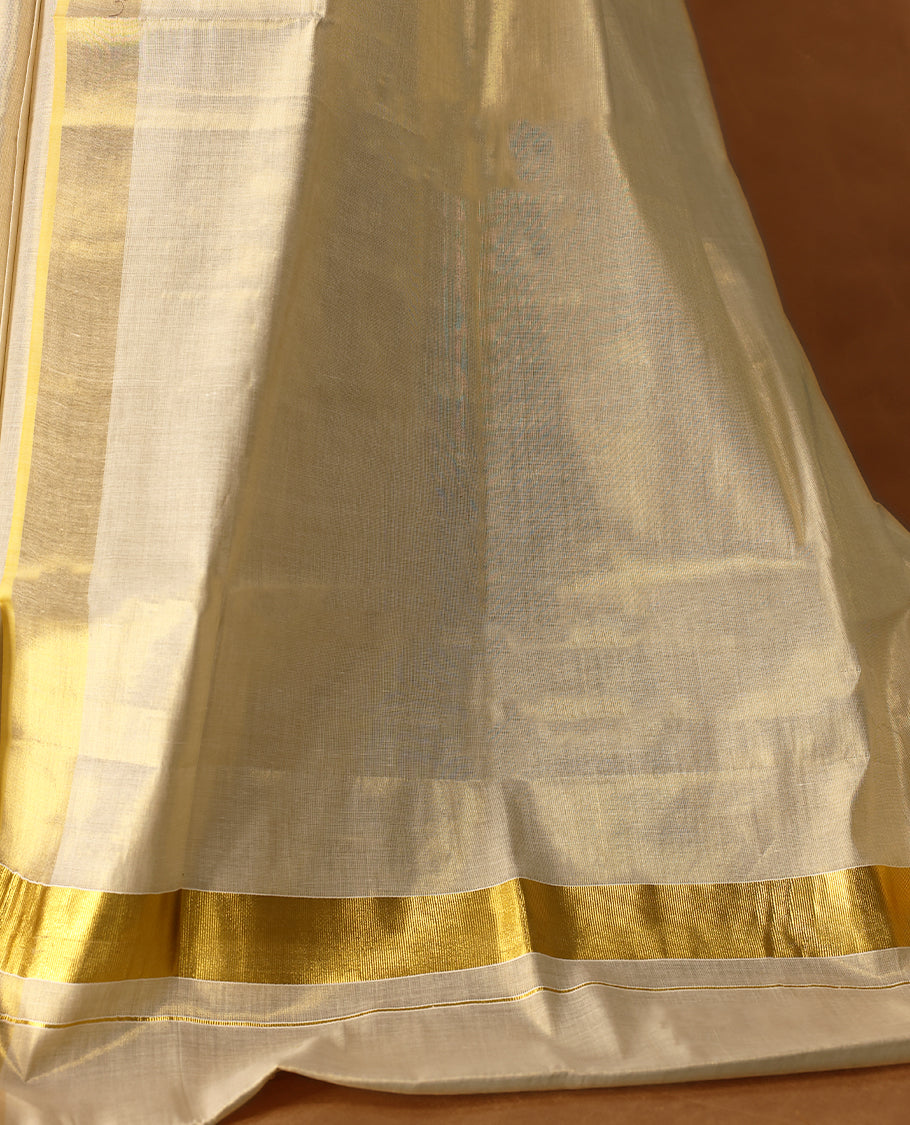 Elegant Light Gold colour Tissue Kerala saree featuring Plain body and traditional Muted golden zari kasavu border offering a classic and graceful look, paired with a matching blouse.