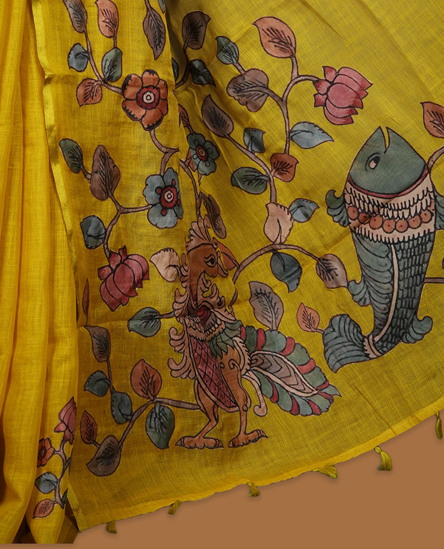Mustard yellow semi linen saree featuring hand painted floral and bird motifs along the pallu and lower body, finished with a subtle border and paired with a matching printed blouse.