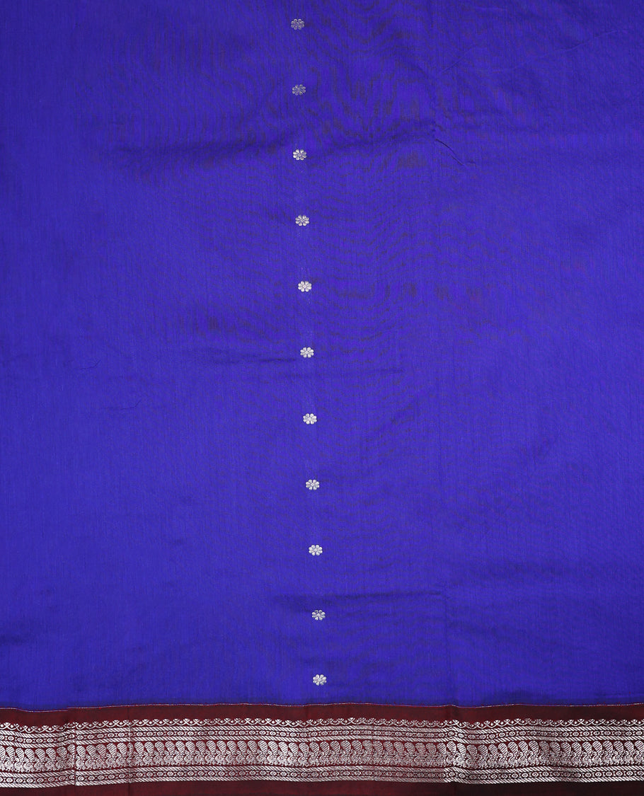 Blue colour mixed Kalyani cotton saree featuring Silver zari flower motifs throughout the body, paired with a Maroon colour traditional border and pallu, with matching blouse