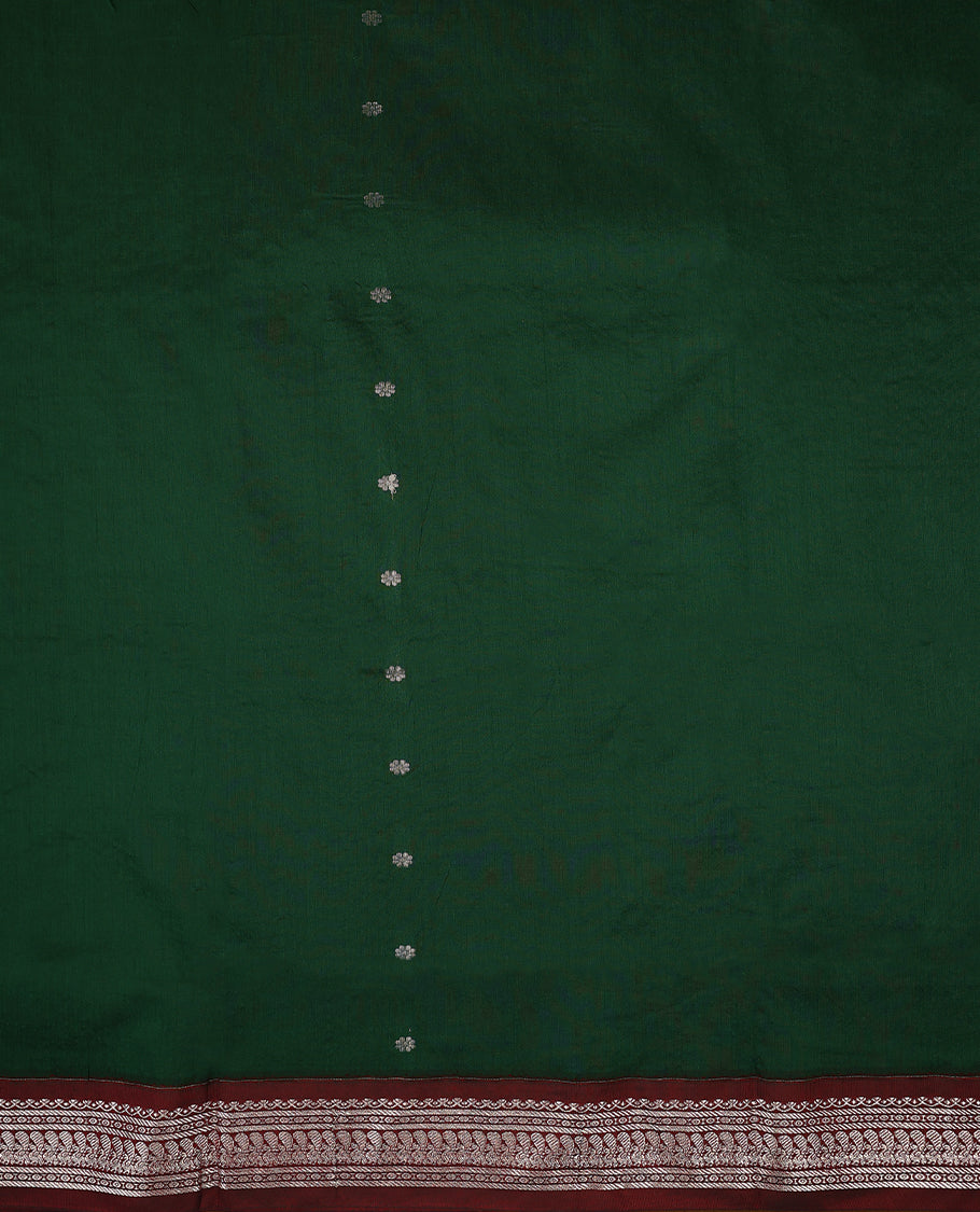 Bottle Green colour mixed Kalyani cotton saree featuring Silver zari flower motifs throughout the body, paired with a Maroon colour traditional border and pallu, with matching blouse
