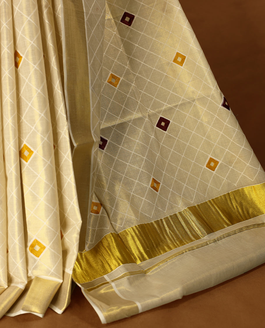 Light Gold colour Tissue Kerala saree featuring thread diamond work on body and a beautifully woven Gold Kasavu border, paired with a matching blouse perfect for festive occasions.