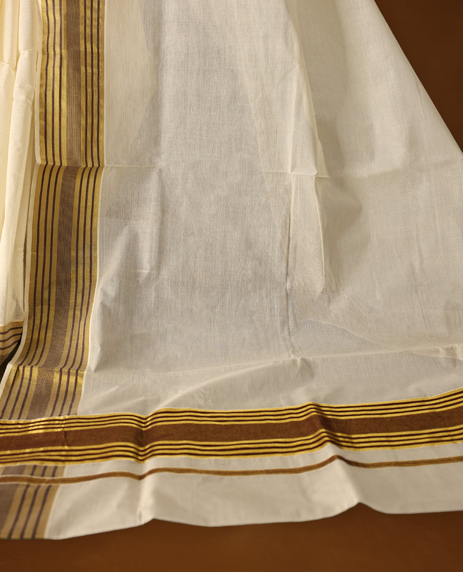 Classic off white colour Kerala cotton saree with rich brown and gold striped border, Lightweight and breathable, it comes with a matching blouse & perfect for traditional functions and everyday elegance.