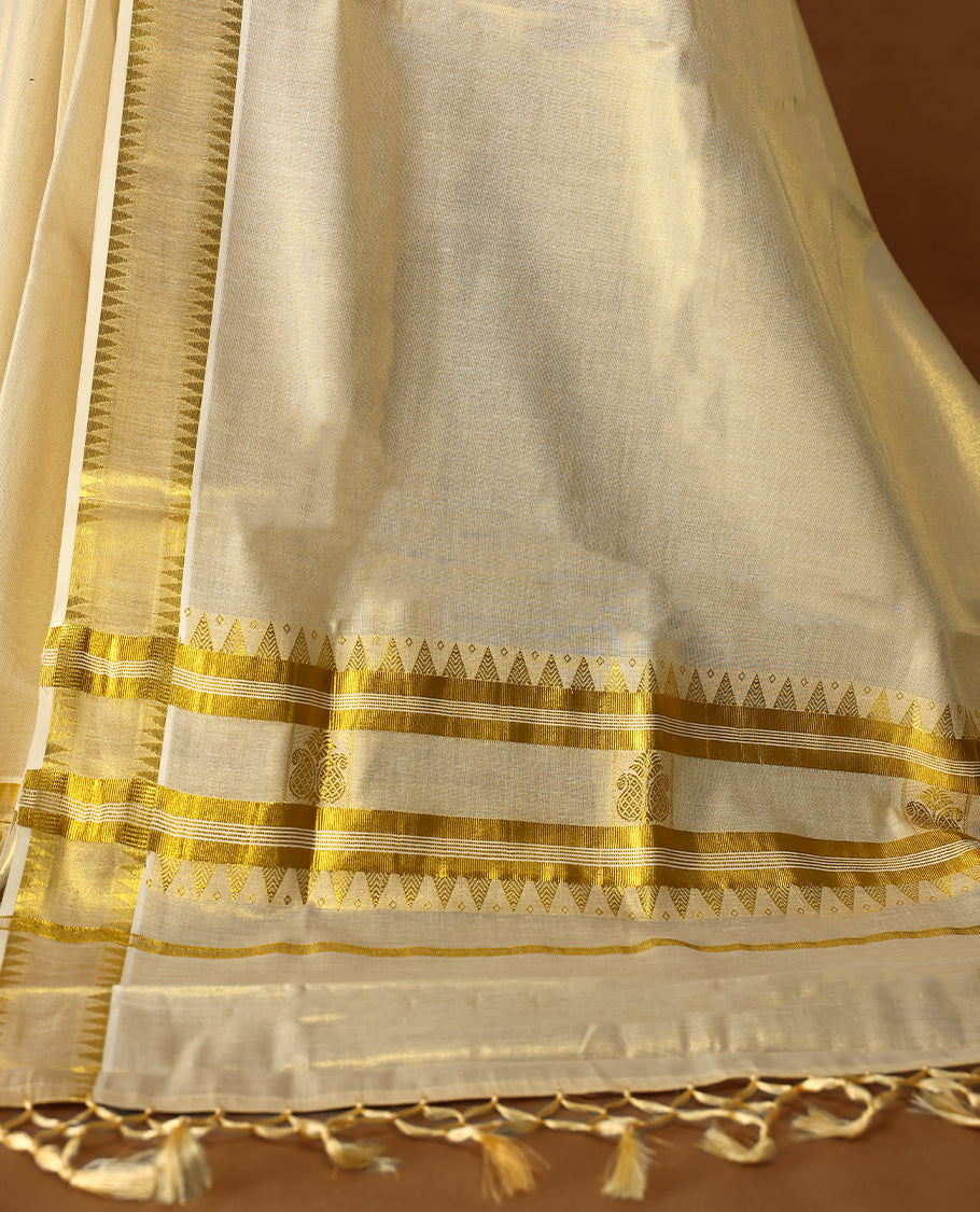 Elegant Light Gold colour Tissue Kerala saree featuring Plain body and traditional golden zari kasavu border, Rich pallu offering a classic and graceful look, paired with a matching blouse.