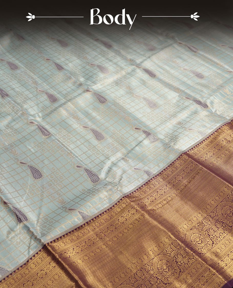Faded blue colour and Antique gold Zari Tissue Brocade Saree features intricate check and bird Motifs on body and rich violet colour border & pallu with traditional patterns paired with contrast blouse