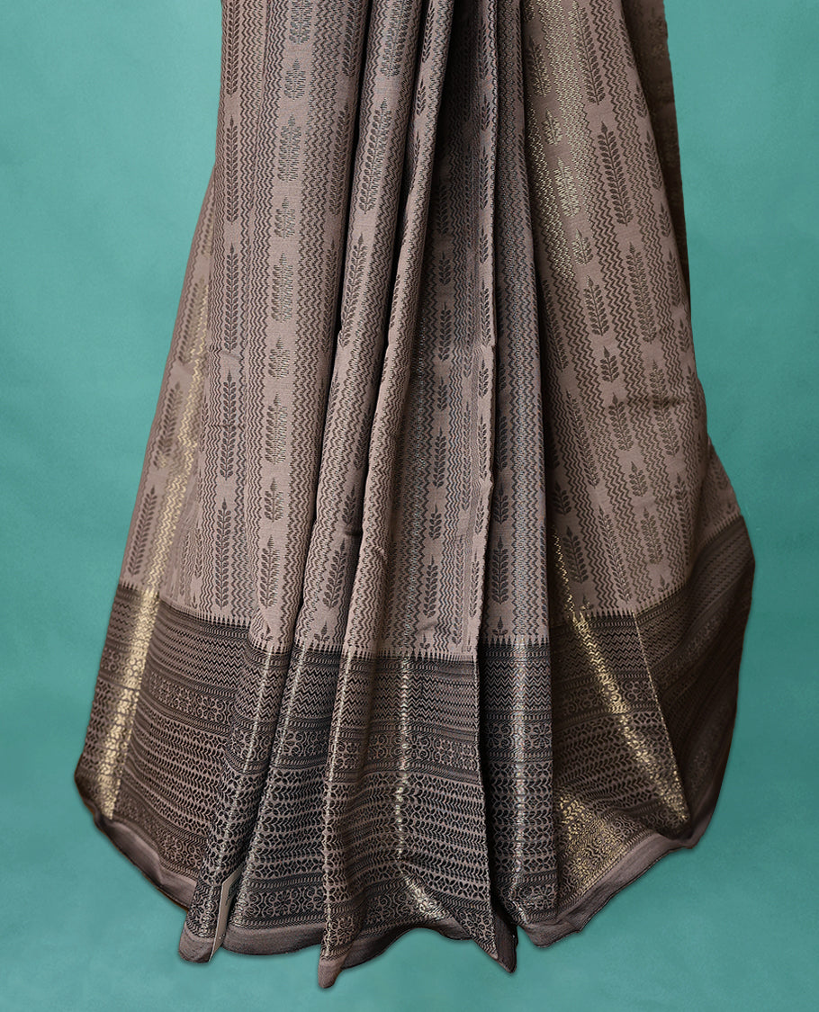 Metallic Beige Art Soft Silk Saree showcases intricate silver zari work on the body and border, paired with a matching blouse