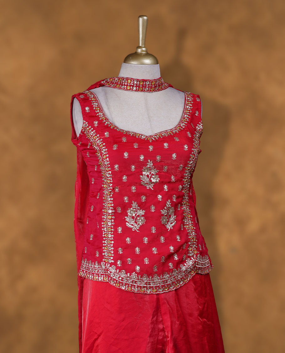 Red colour sharara set adorned with intricate silver embroidery and sequins work & The fitted embellished top pairs beautifully with the flared bottoms and matching dupatta.