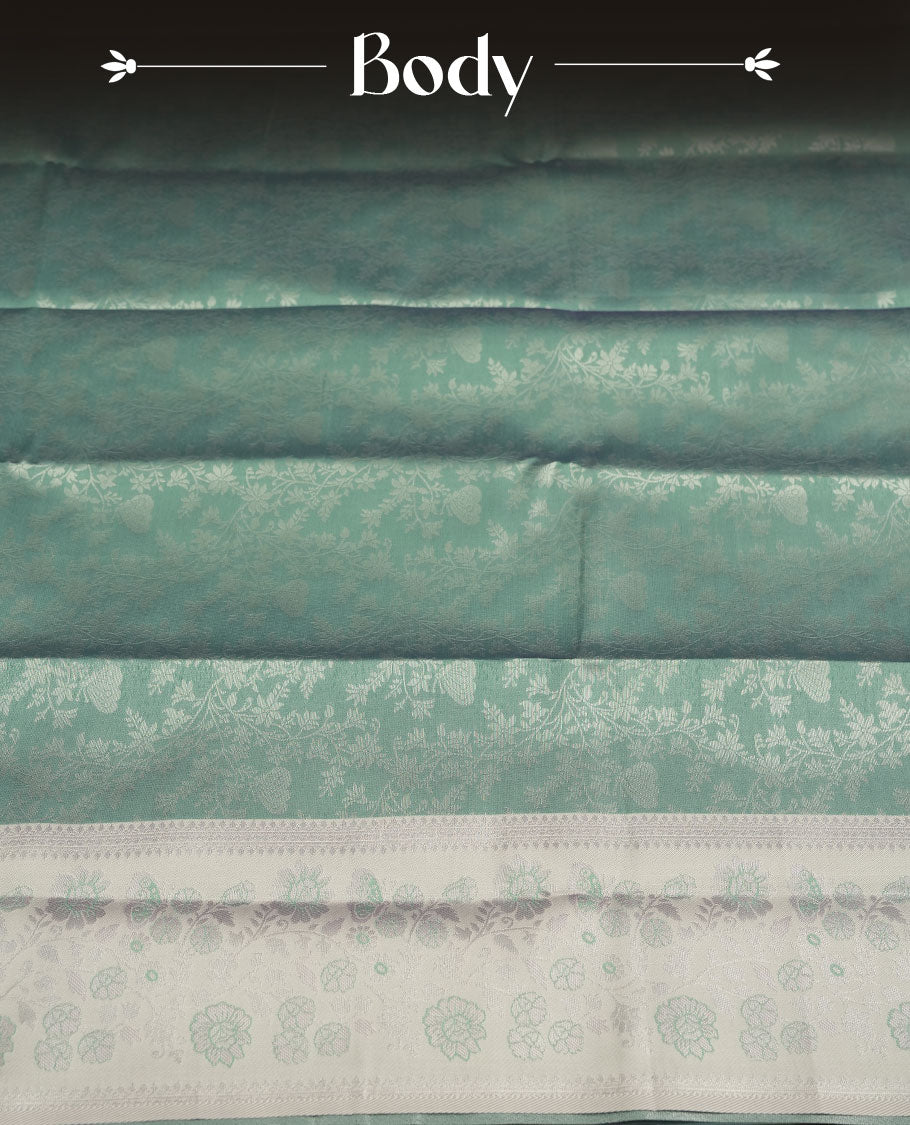 Seafoam Green colour Semi Silk Saree with Allover Subtle Floral Self-Weave on the Body, Contrasting Silver Zari Woven Pallu and Border Featuring Intricate Geometric Motifs and Tassels, Paired with Coordinated Blouse Piece