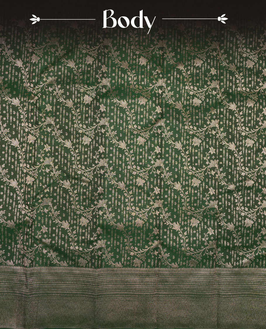 Bottle green colour Kanchipuram pattern Manthrakodi saree featuring kodi floral antique zari jacquard all over, geometric turning border and self zari blouse piece.