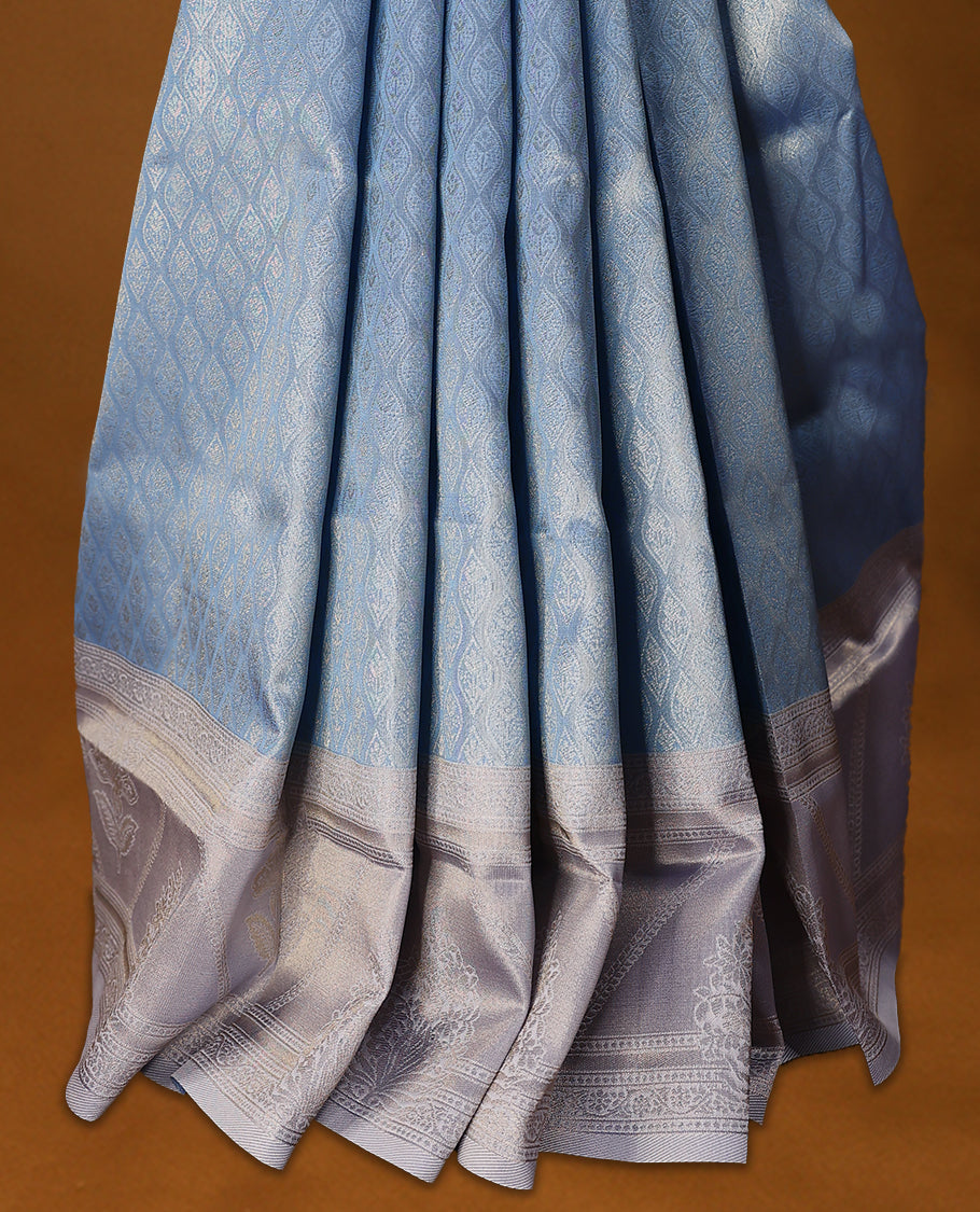 Light Blue coloured semi silk saree featuring a Golden Brocade body, paired with a Light Pastel Purple coloured border and matching blouse.