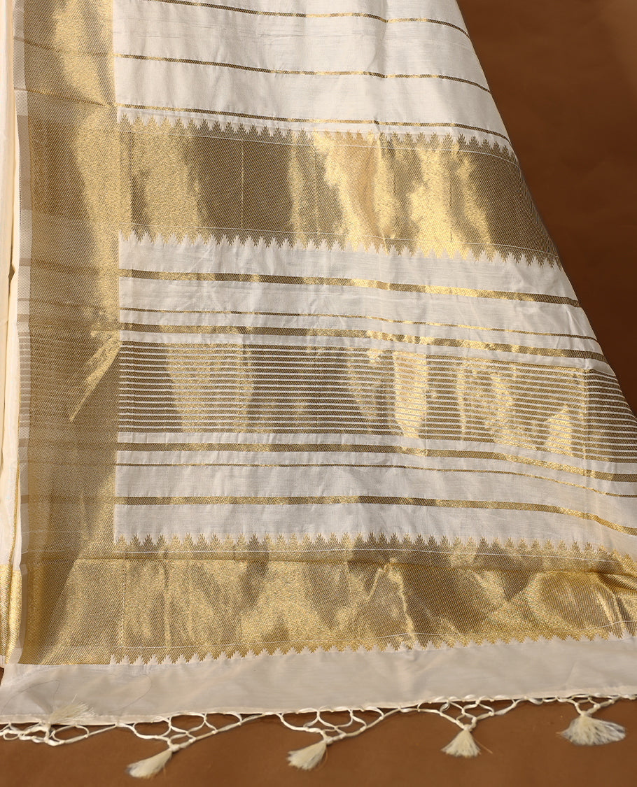 Elegant white colour sotf Tussar Kerala saree featuring thin stripes on body, Gold kasavu border, Rich Pallu, Paired with matching blouse offering a classic and graceful look